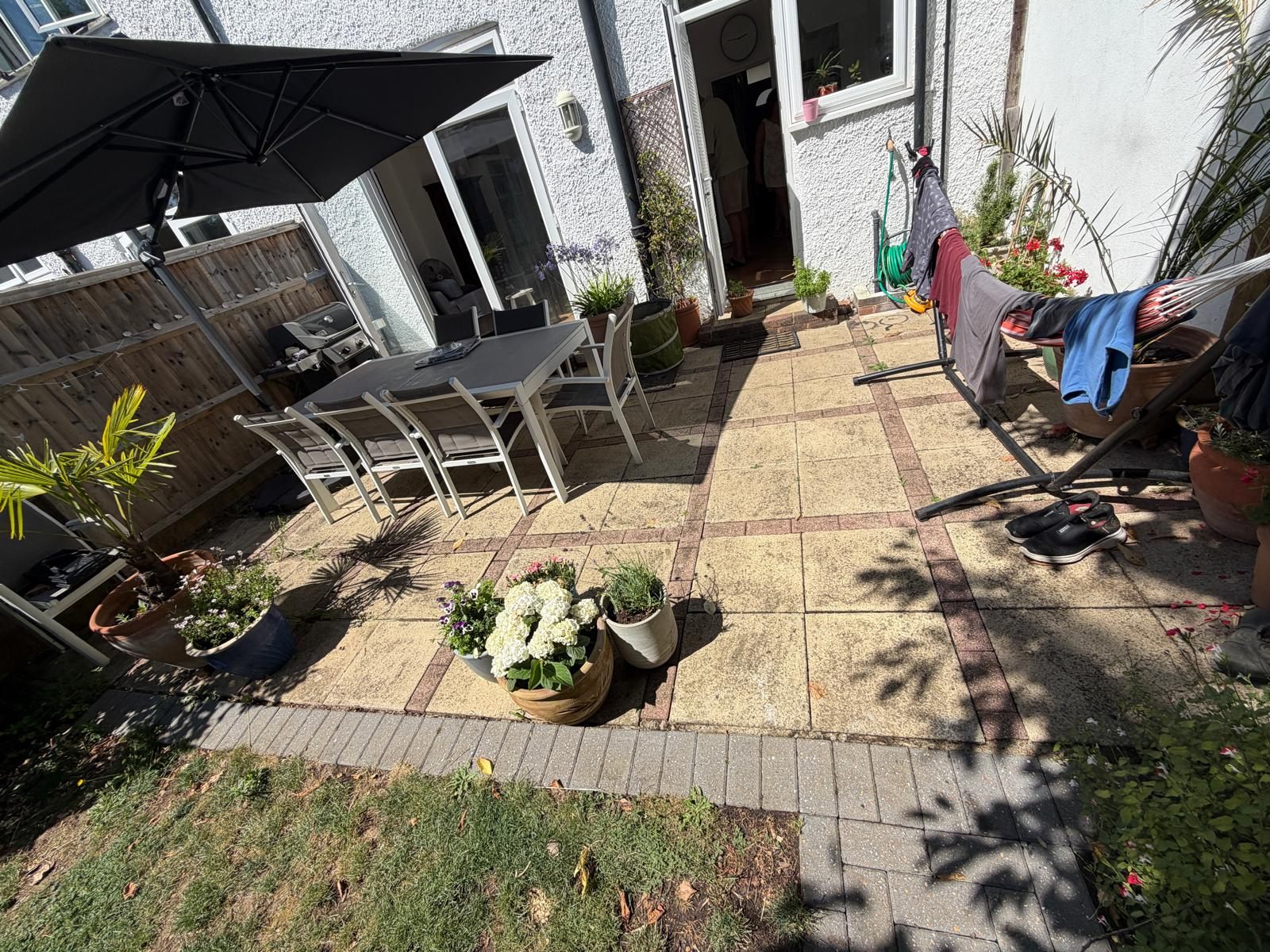Worn original concrete slab patio before renovation, Surrey
